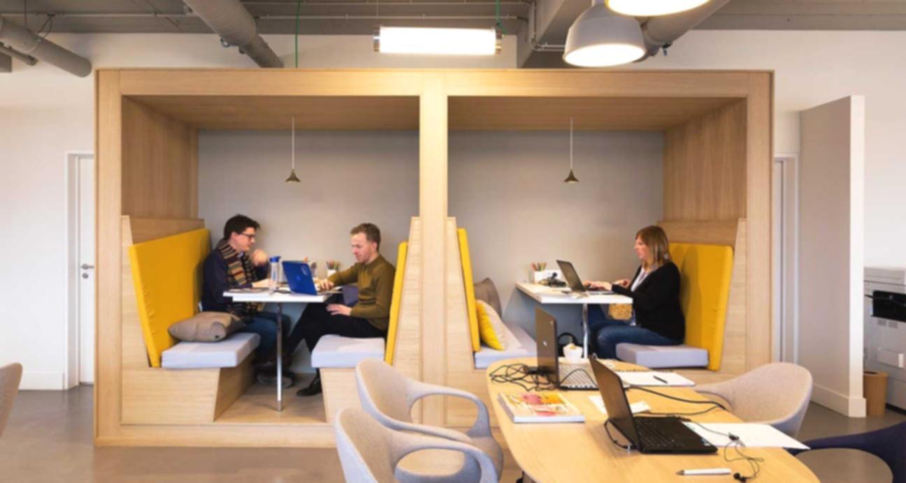 Professional presenting financial data to engaged audience